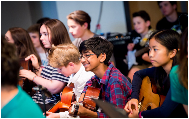 A group of young people play together as part of the big band at SCO VIBE, a fusion orchestra project for 12-18 year olds. Edinburgh, July 2017