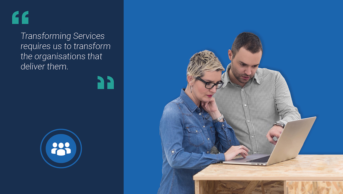 Image of colleagues working at a laptop together
