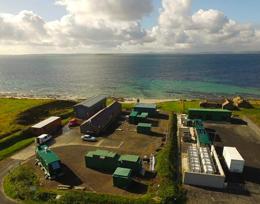 European Marine Energy Centre in Orkney with sea in background 