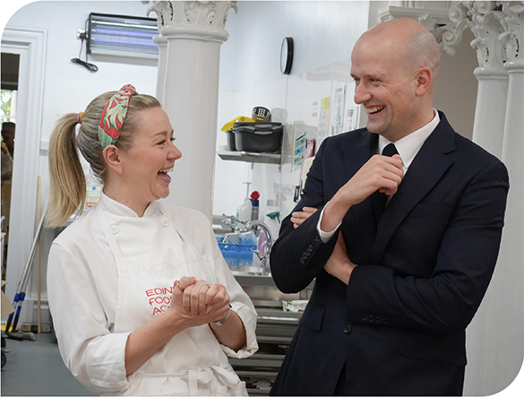 Cabinet Secretary Stephen Flynn laughs with a chef at Edinburgh Food Academy 