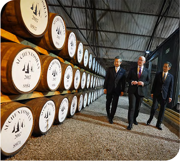 First Minister is shown whisky barrels at Auchentoshan Distillery 